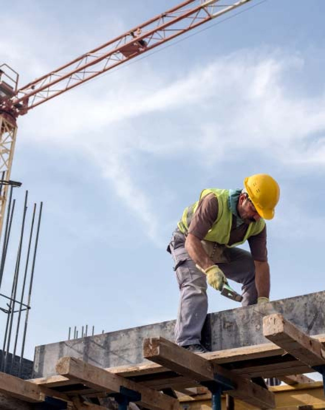 Worker assembling wooden framing