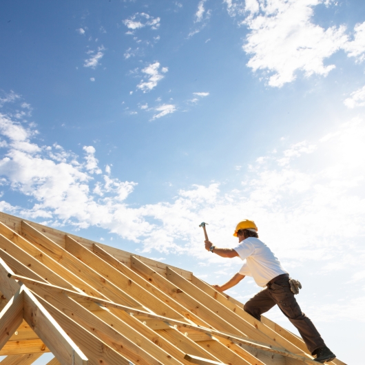 Worker building a wooden foundation